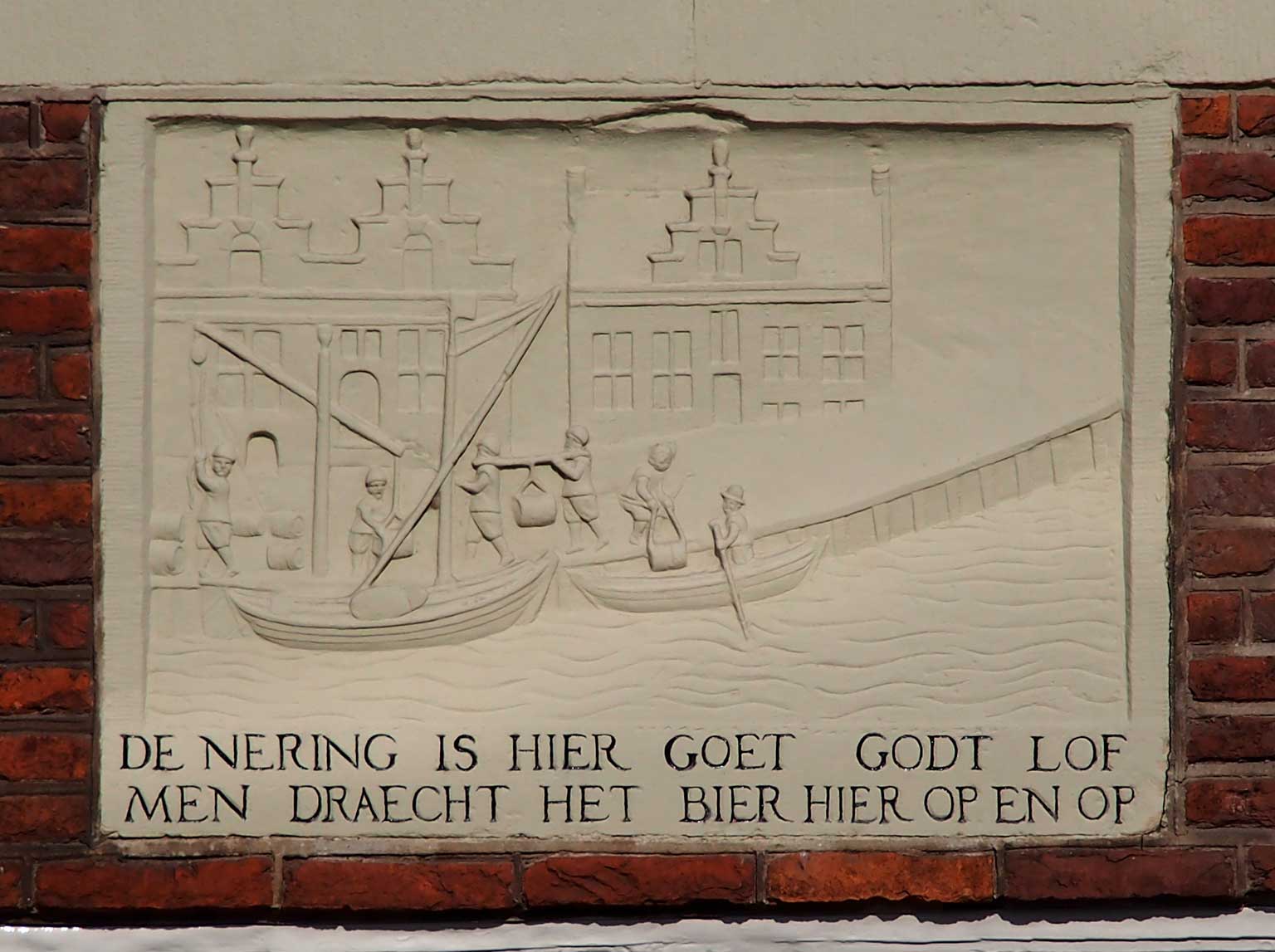 Restored gable stone on the façade of the Aalsmeerder Veerhuis, Amsterdam