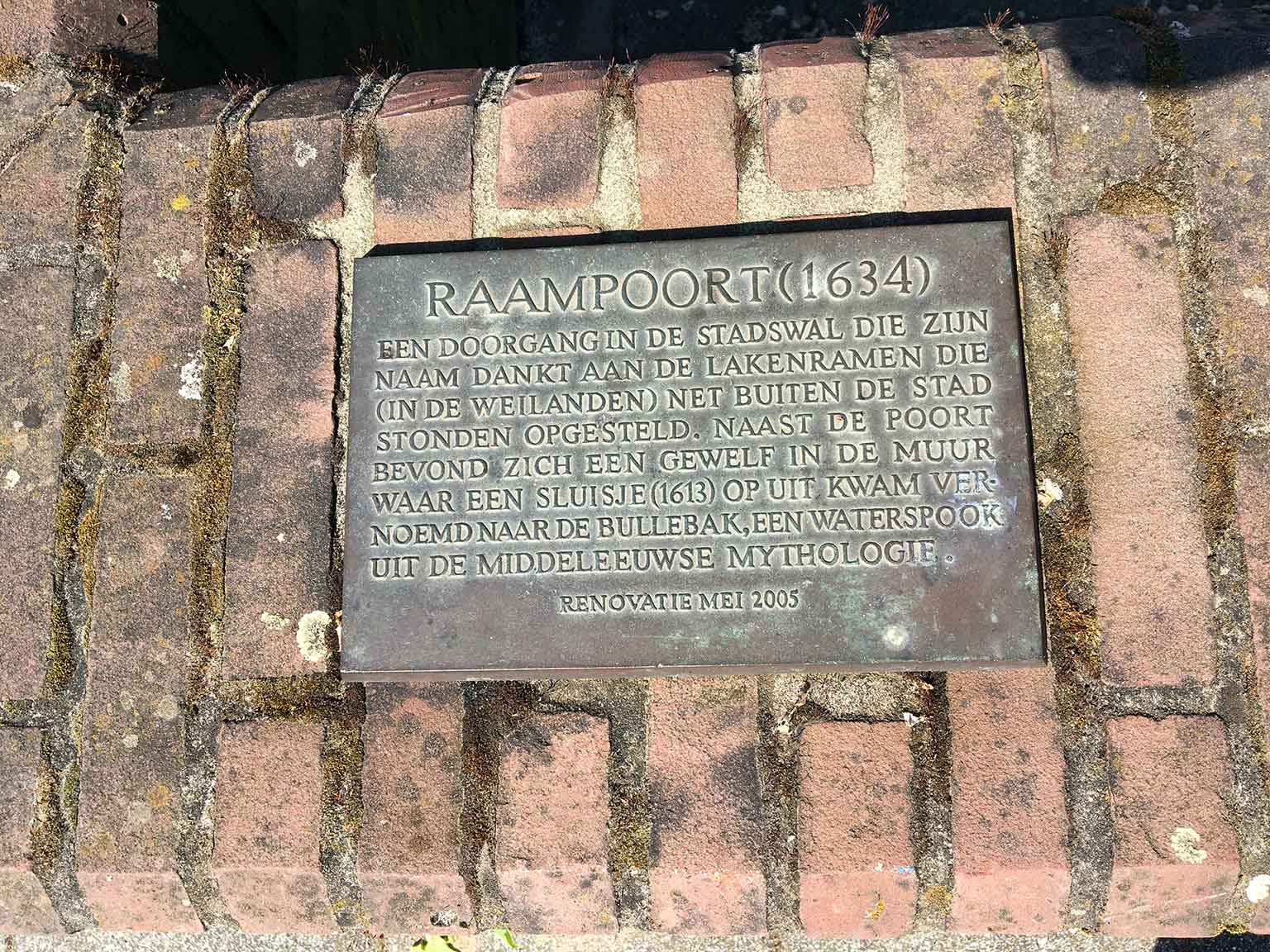 Raampoort plaque on the Bullebakssluis wall near Marnixstraat, Amsterdam