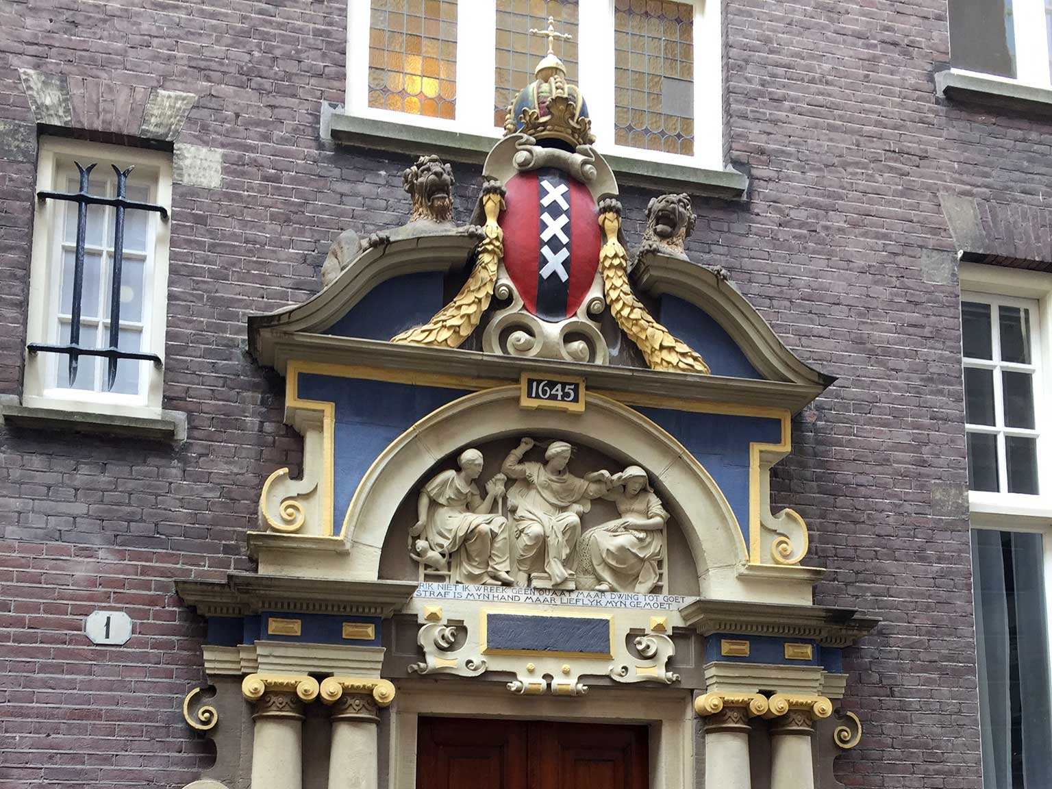 Imperial crown above the Amsterdam seal at the Spinhuissteeg, Amsterdam