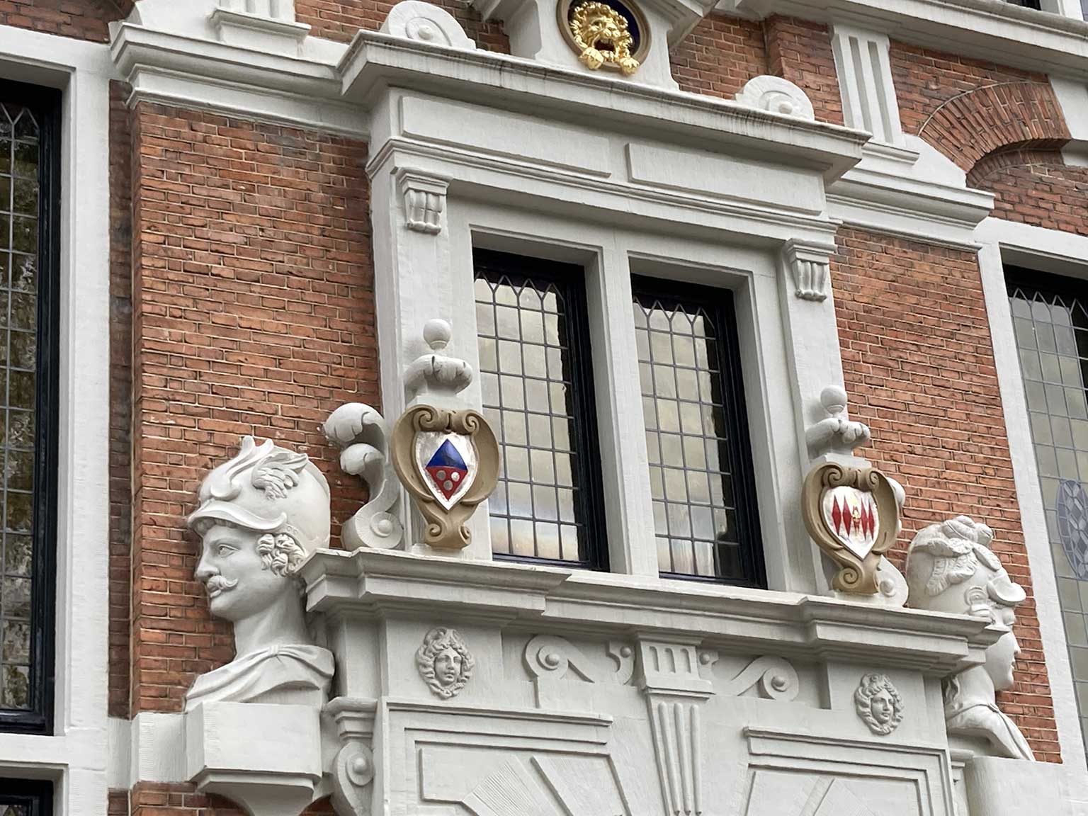 Heads of Mercury and Minerva above the entrance of Keizersgracht 123, Amsterdam