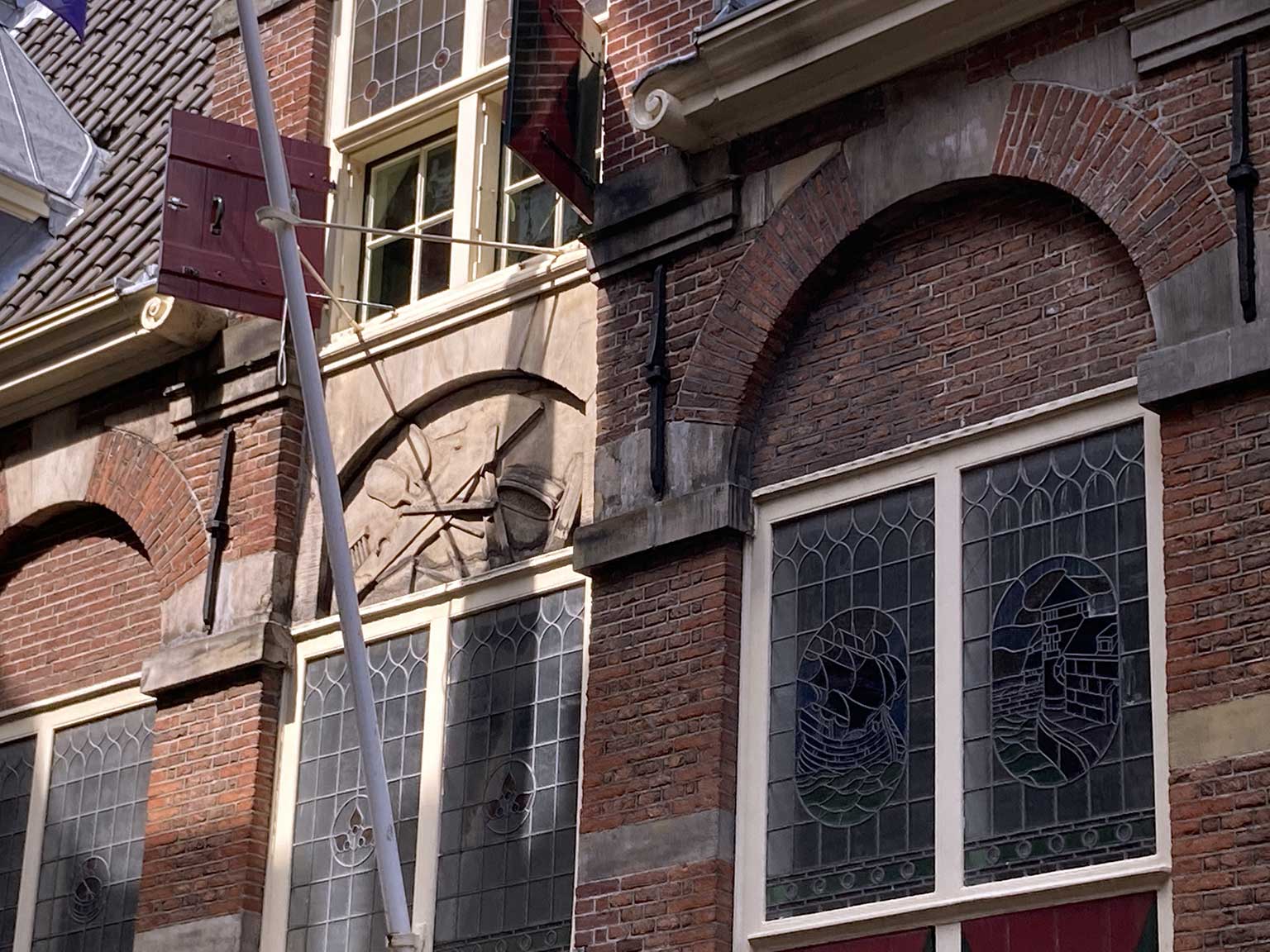 Relief above the front door of the Korenmetershuis, Amsterdam