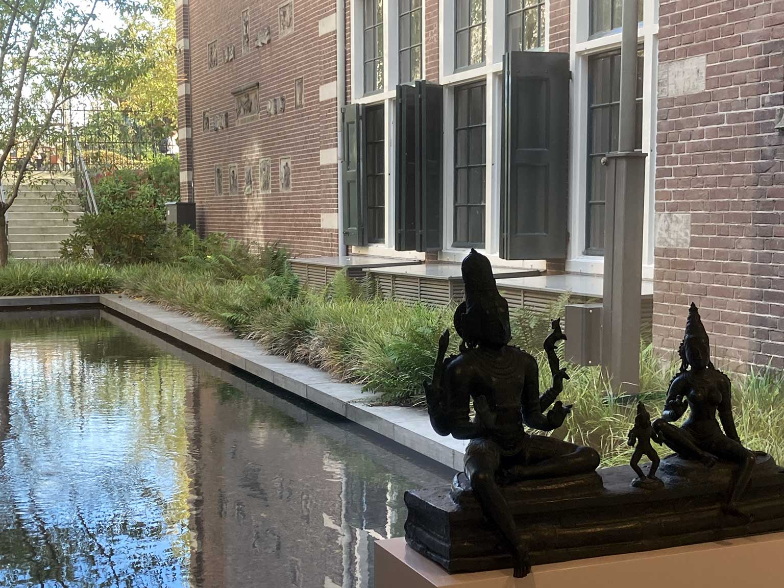 View of the pond and Fragments building of the Rijksmuseum, Amsterdam, from the Asian pavilion