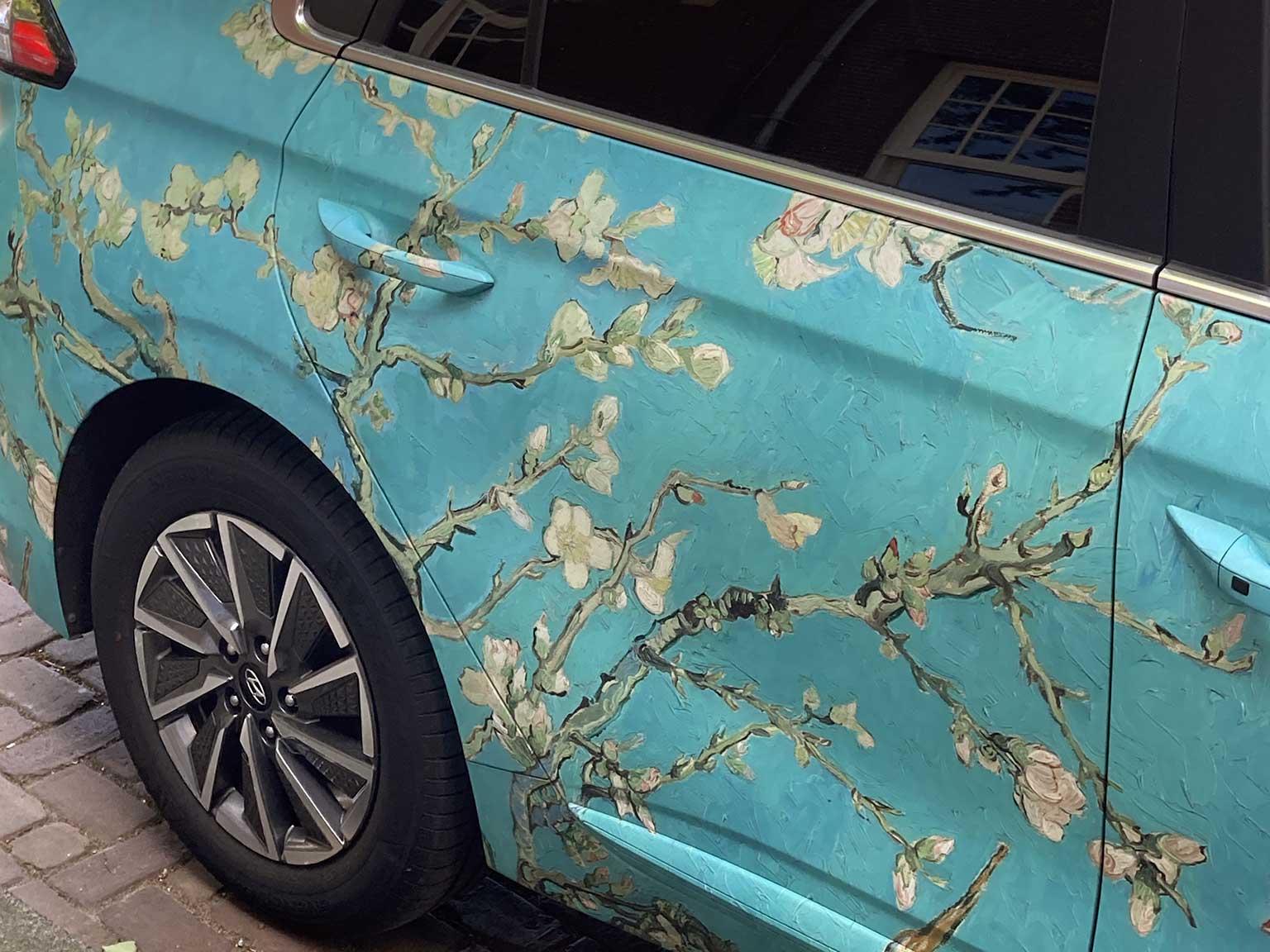 Car with a wrap of Almond Blossoms from a painting by Vincent van Gogh